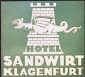 Hotel Sandwirt Klagenfurt luggage label with cream dragon and tower on a green background