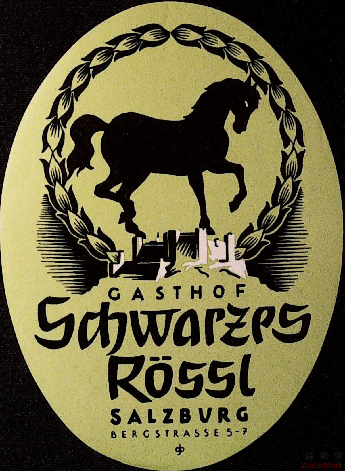 Oval yellow-green Gasthof Schwarzes Rössl Salzburg luggage label with black horse silhouette, decorative wreath and stylised buildings