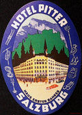 Oval Hotel Pitter Salzburg luggage label with hotel building, Alpine backdrop and sports equipment in a blue-purple border