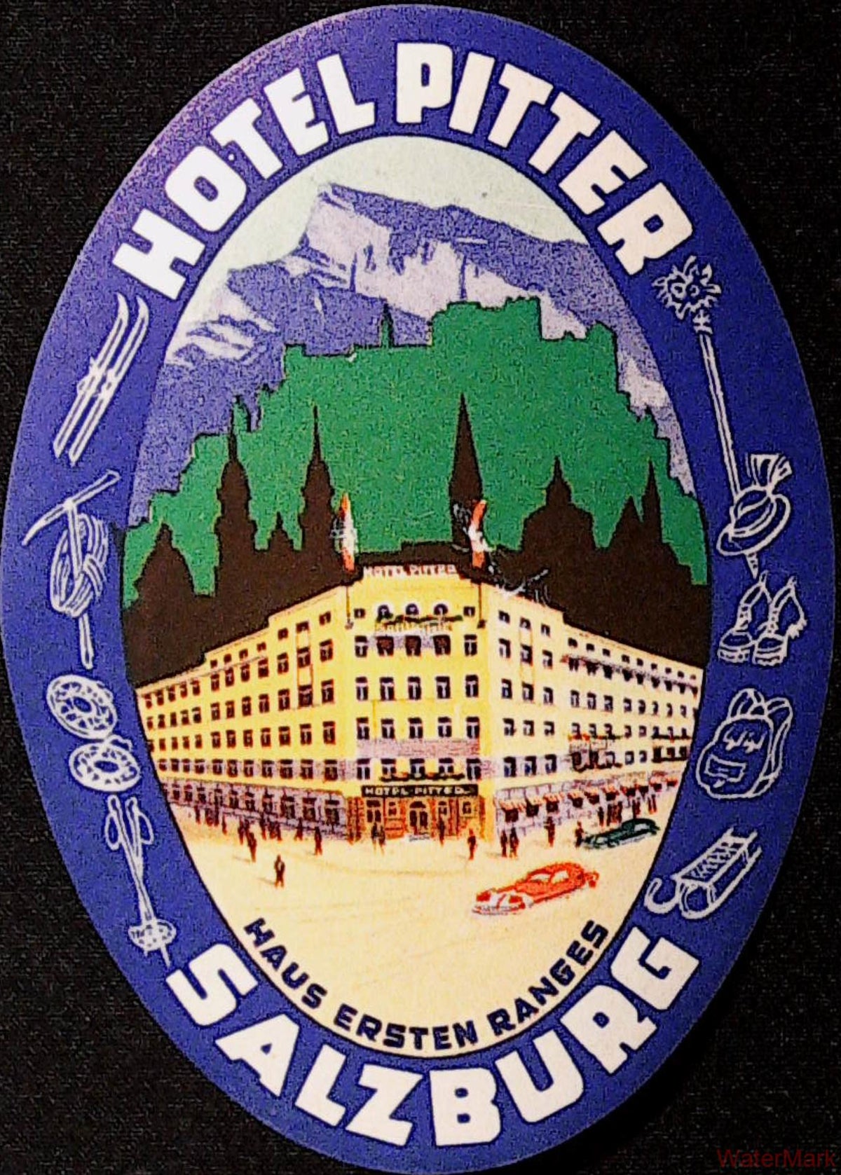 Oval Hotel Pitter Salzburg luggage label with hotel building, Alpine backdrop and sports equipment in a blue-purple border