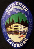 Large oval Hotel Pitter Salzburg luggage label with Alpine scenery, hotel illustration and sports equipment around a blue-purple border