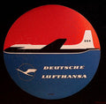 Circular Deutsche Lufthansa DDR airline luggage label with black-and-white aircraft on a red and blue background
